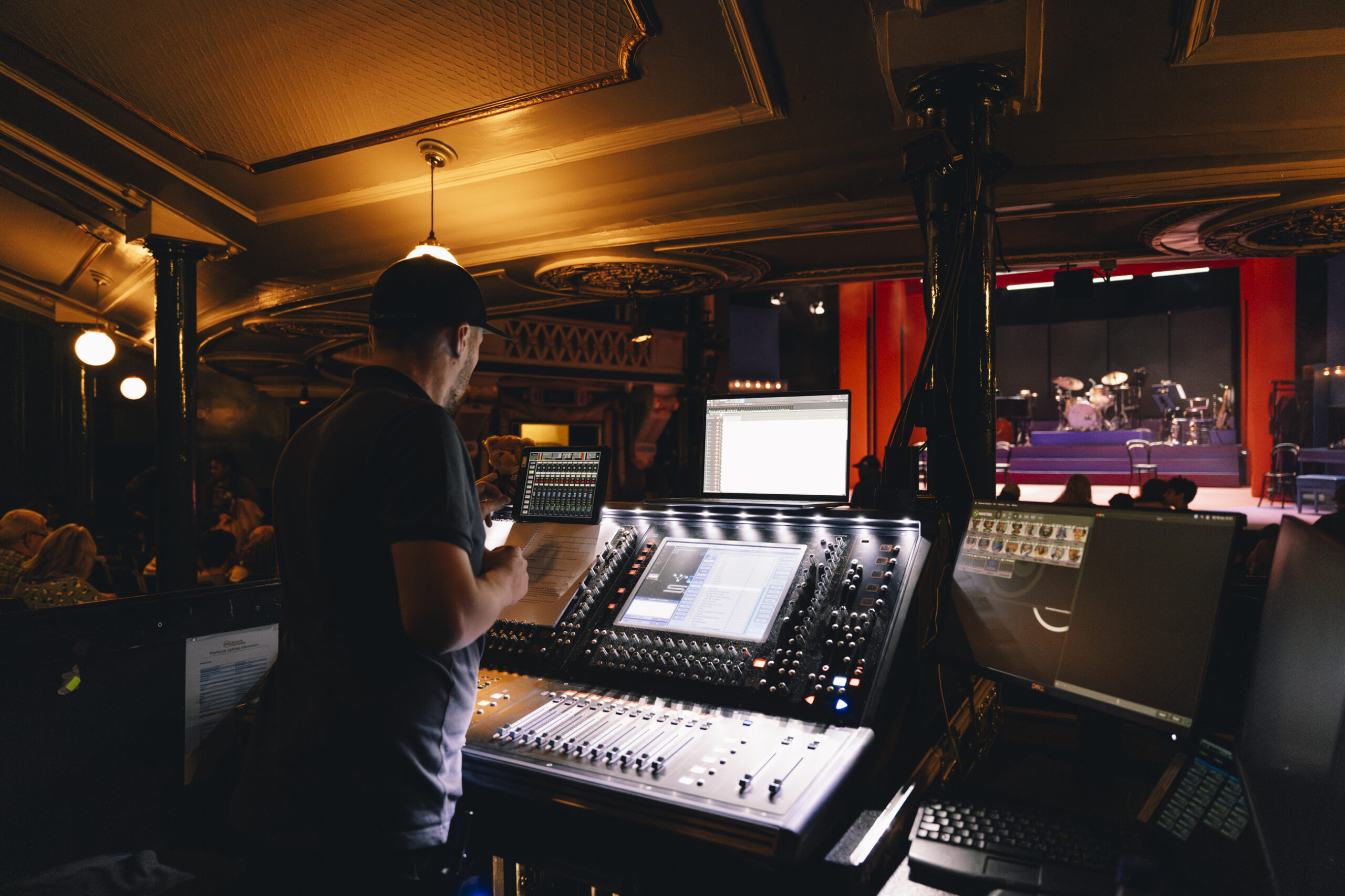 A tech manager works with stage controls in the Liverpool Playhouse.